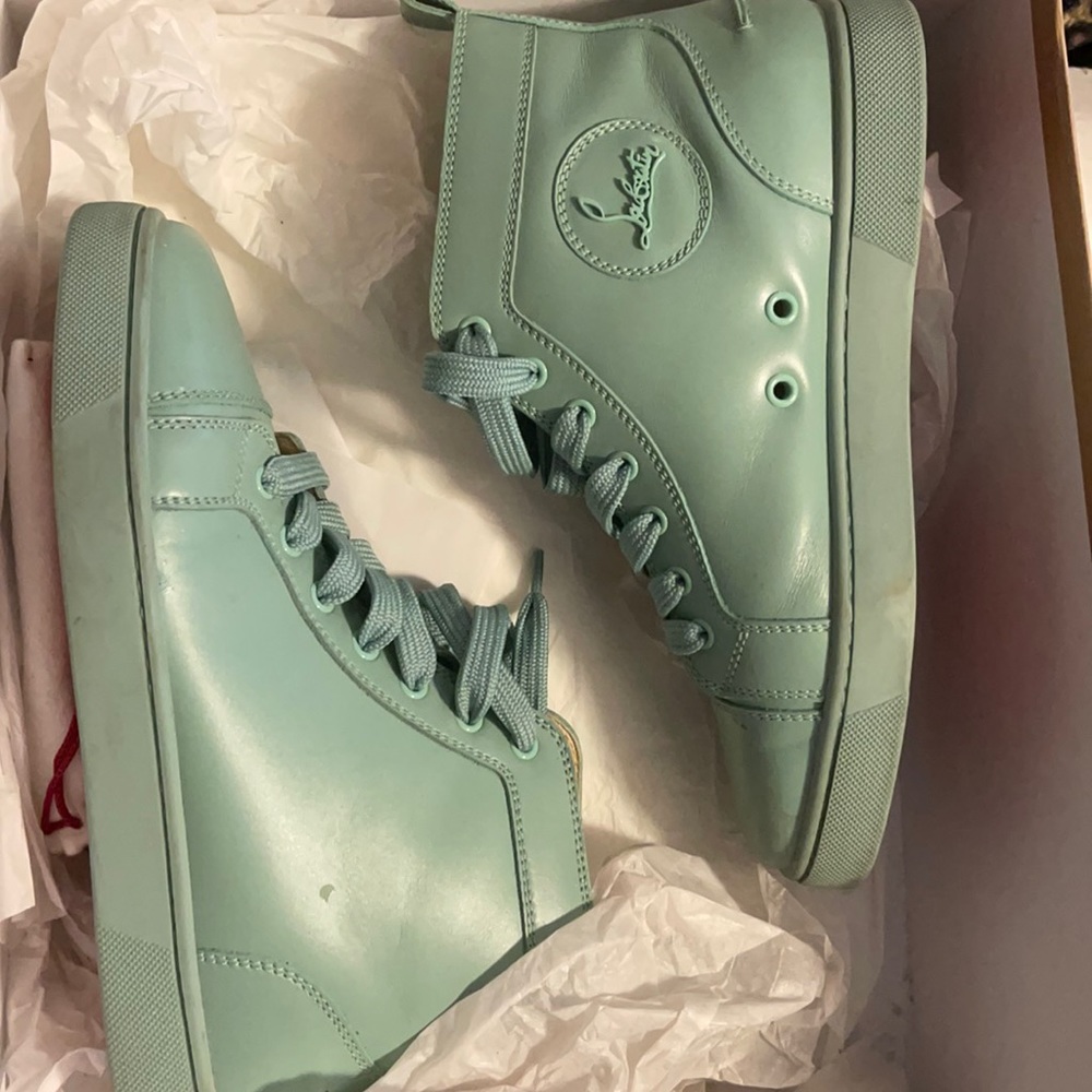 Christian louboutin sneakers good condition box is damage comes with dust bag